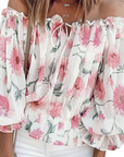 Schulterfreie Bluse mit Blütenmuster für Eleganz 1